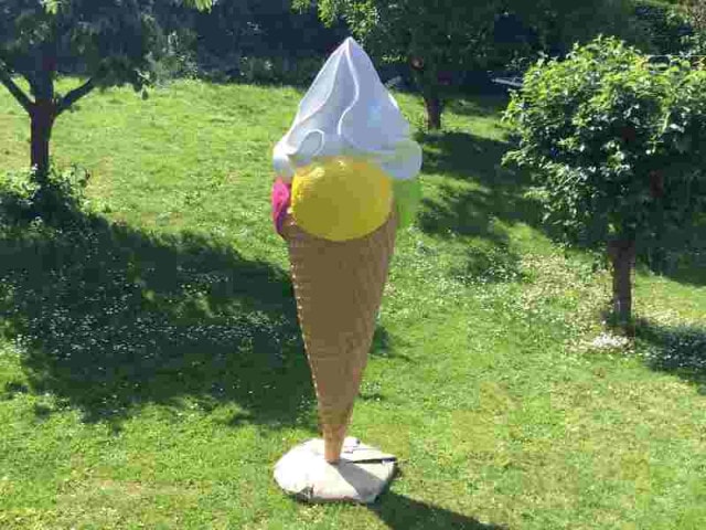 Huge ice cream cone with whipped cream